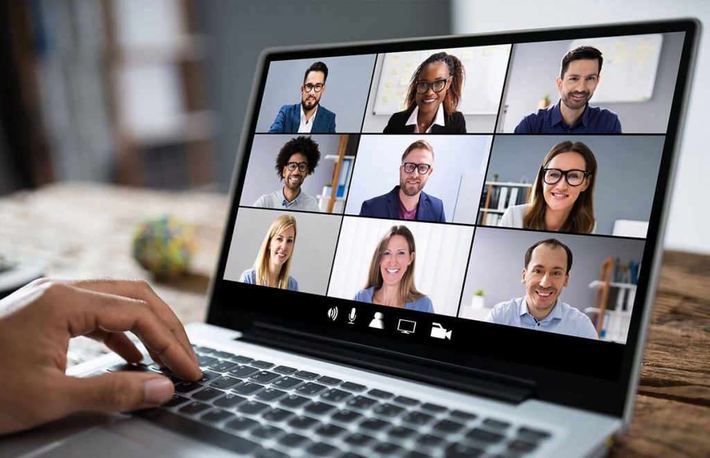 A person using a laptop for a video conference and how to avoid video conferencing fatigue