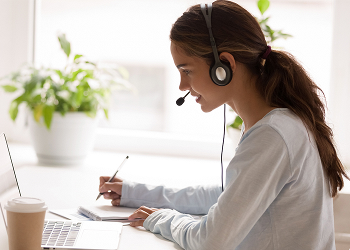 A woman managing an operator assisted event call